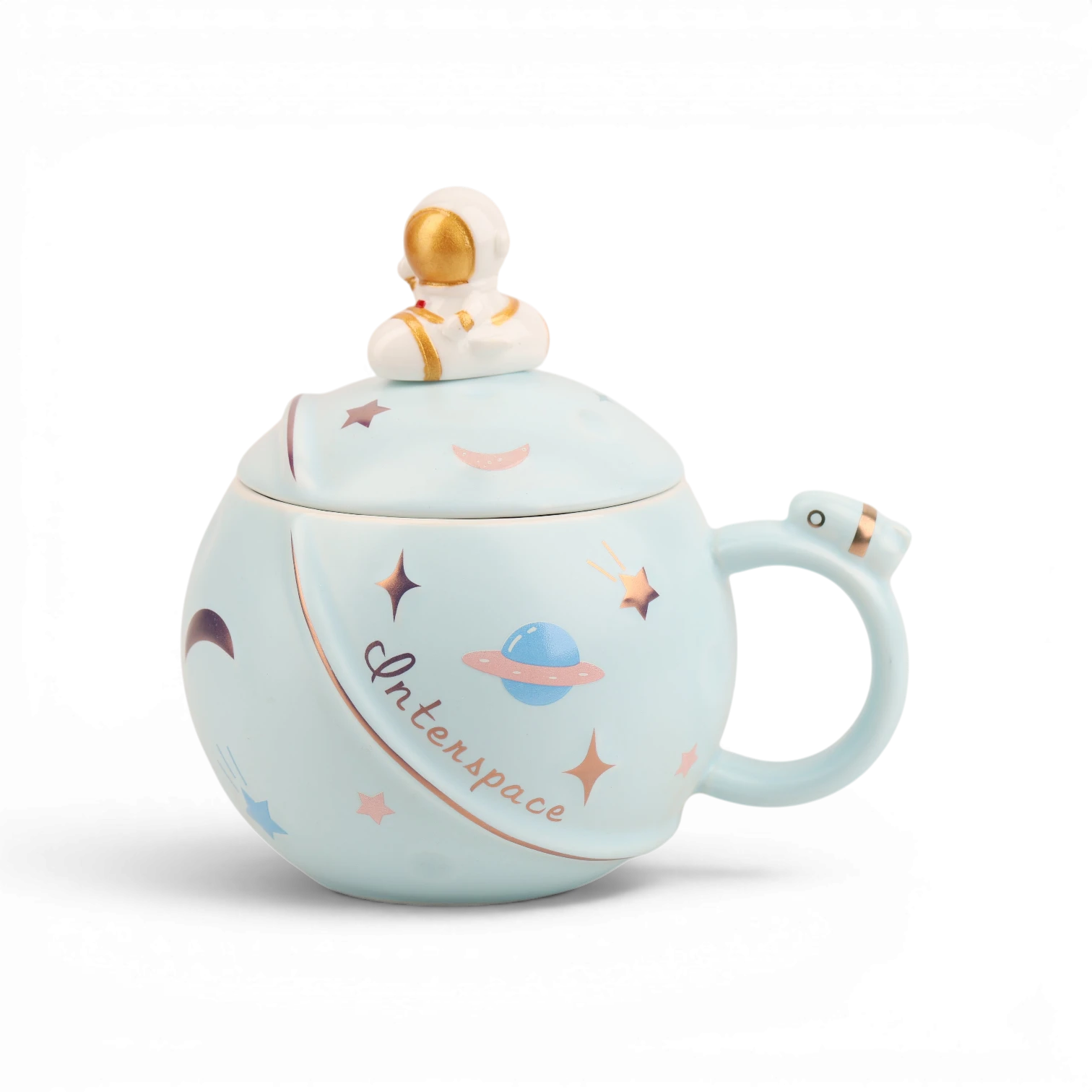 Light blue ceramic mug with astronaut and planet illustrations, gold astronaut finial lid