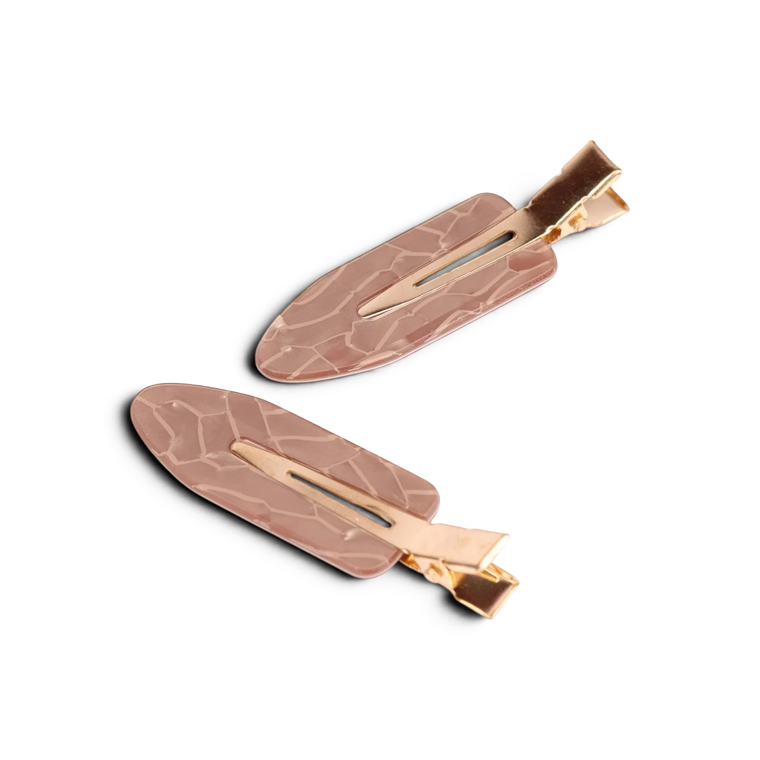 Pair of rose gold acrylic resin hair clips with textured surface and gold-tone metal clasp
