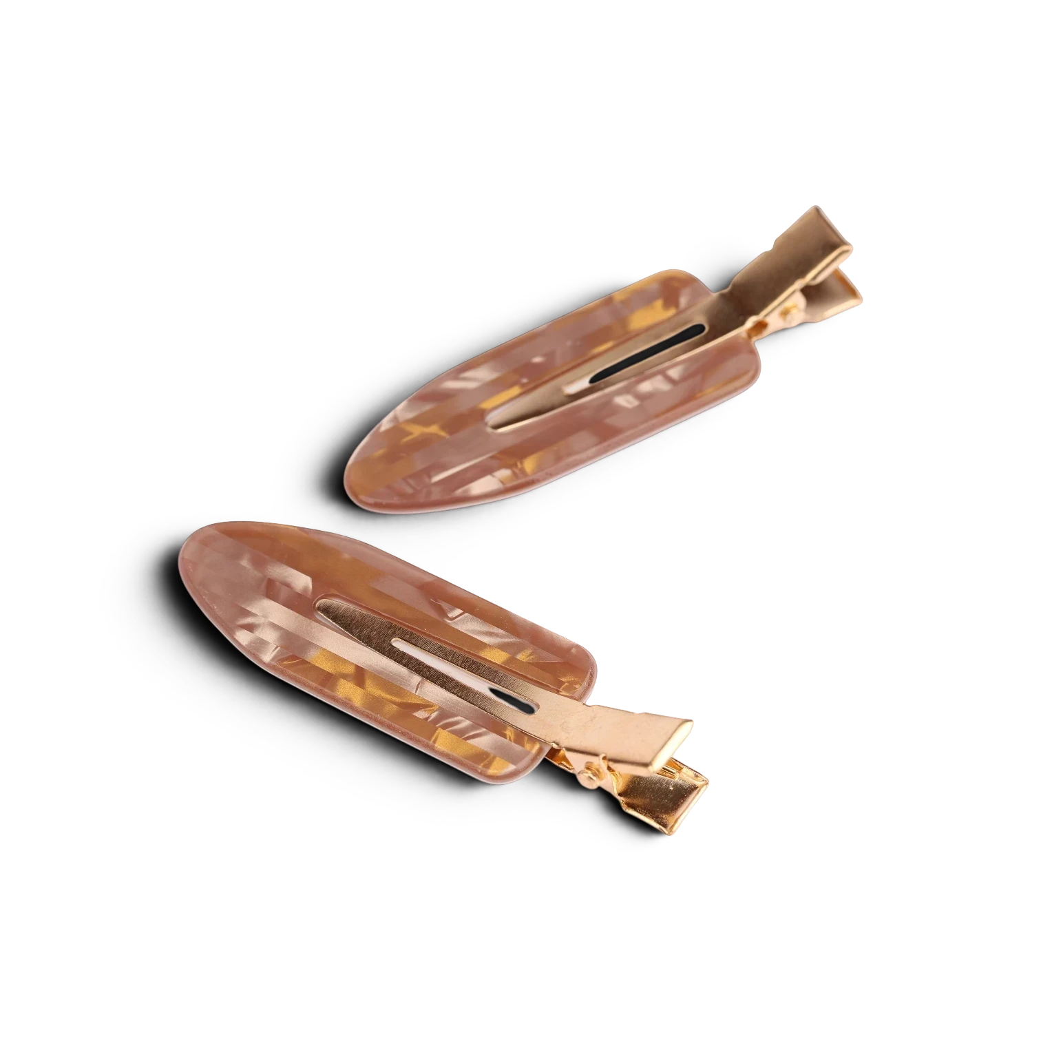 Tortoiseshell acrylic resin hair clips with gold-tone metal clasps, pair displayed on white background
