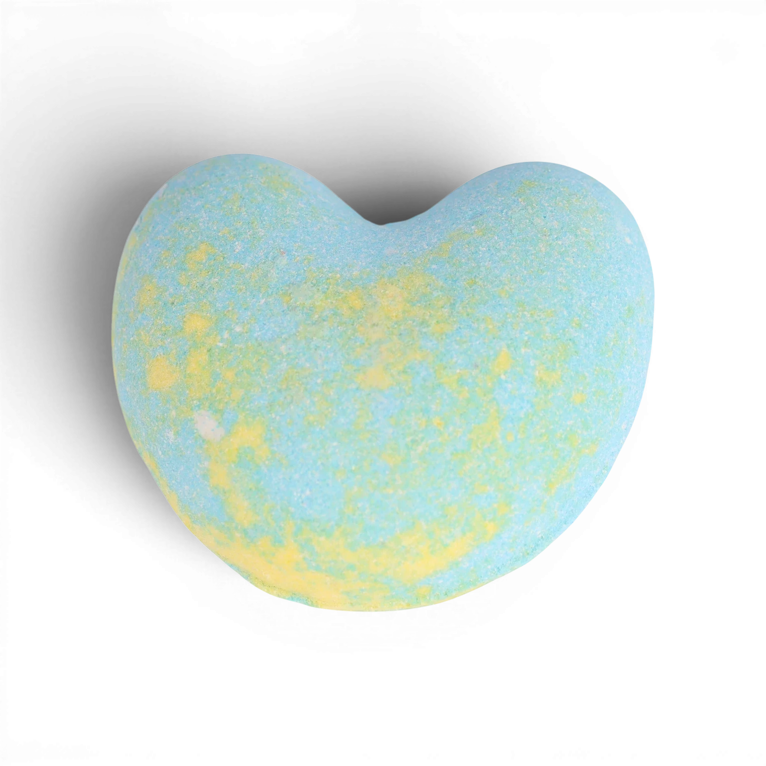 Blue and yellow heart-shaped bath bomb with fizzy, speckled texture and nourishing oils