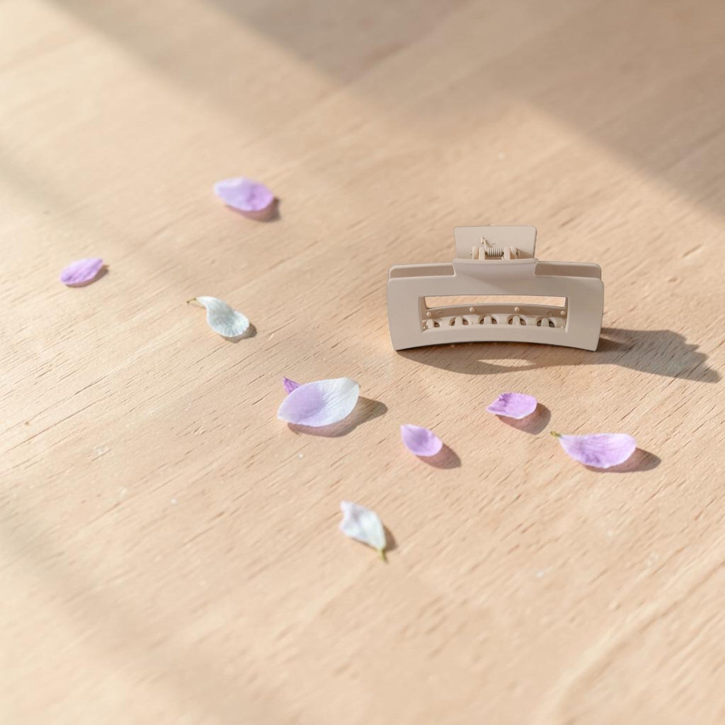 Boxigami beige rectangular claw clip with a matte finish and strong spring-loaded jaw for secure styling.