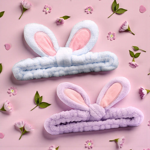 Boxigami diadema de felpa morada con orejas de conejo, ideal para rutinas de maquillaje y cuidado de la piel.