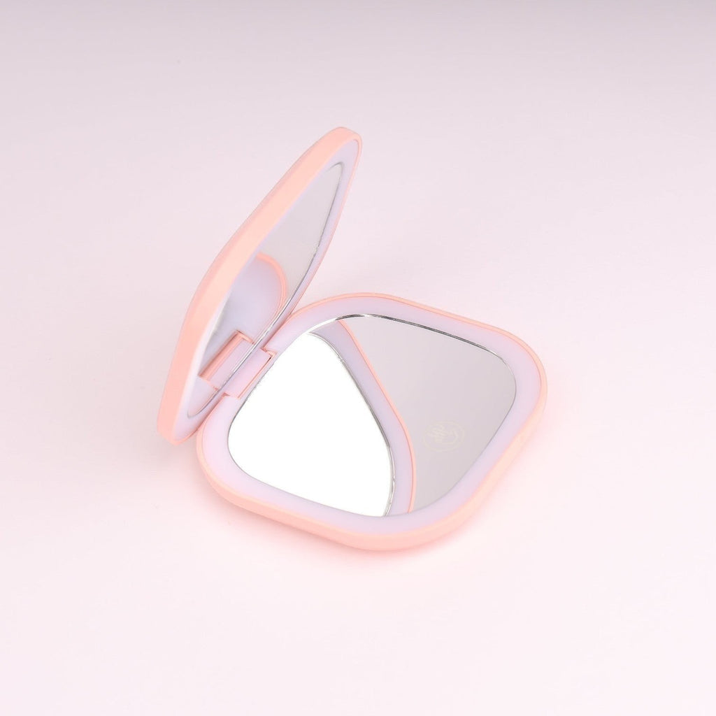 Boxigami espejo de maquillaje LED compacto y portátil, color melocotón, con luz ambiental y función de aumento. Recargable por USB.