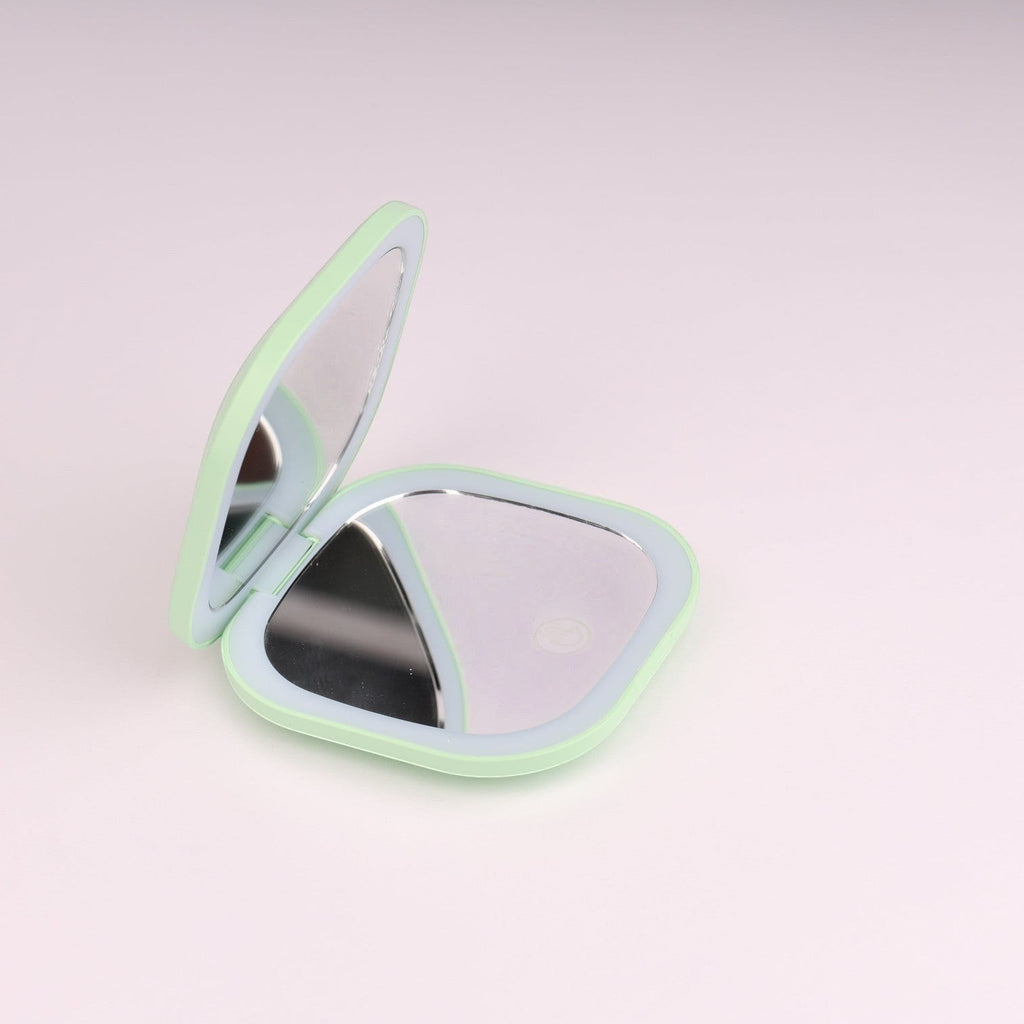Espejo de maquillaje compacto plegable Boxigami verde menta con luz LED y función de aumento. Portátil y recargable por USB.