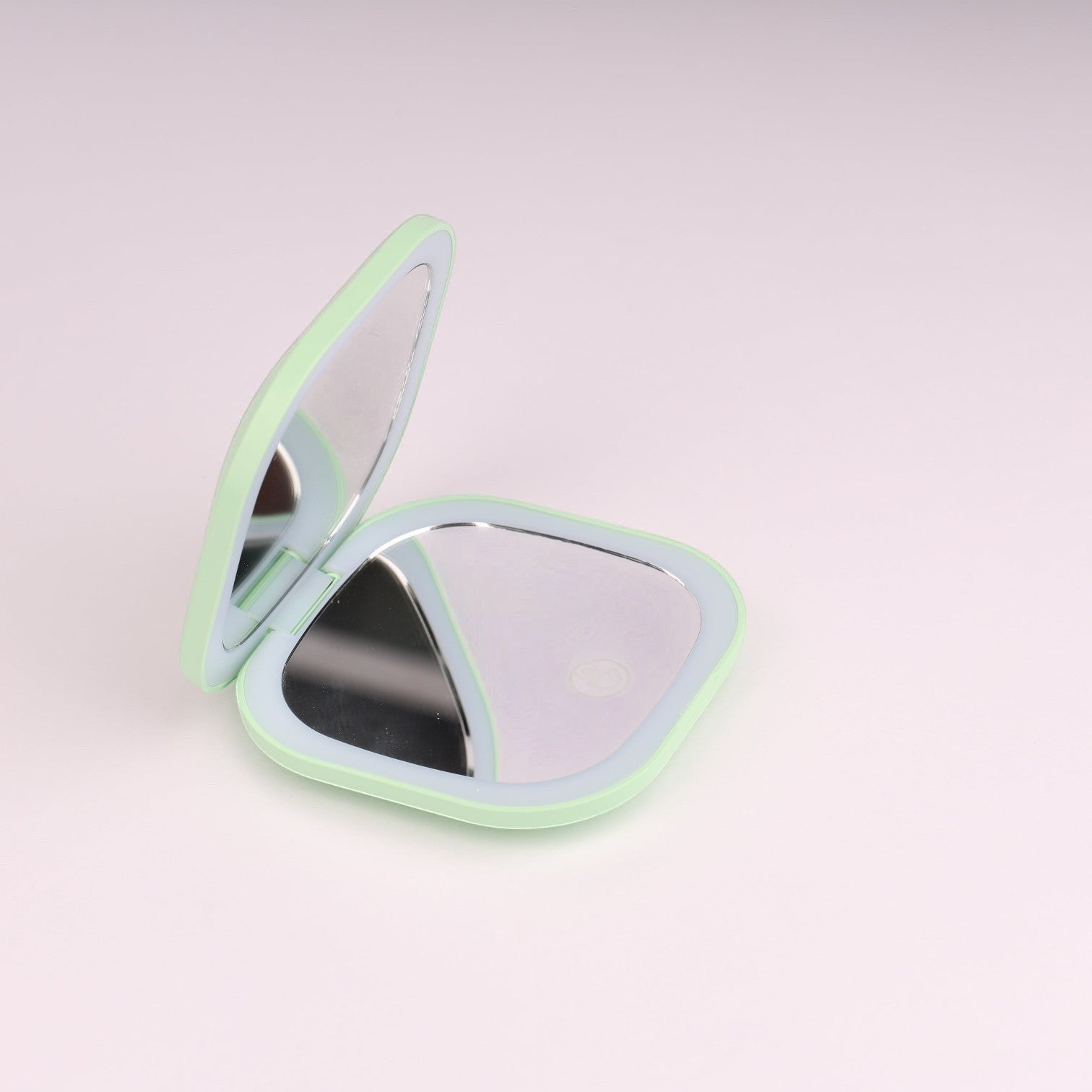 Espejo de maquillaje compacto plegable Boxigami verde menta con luz LED y función de aumento. Portátil y recargable por USB.