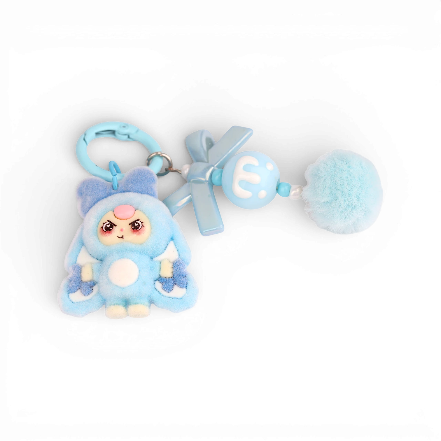 Boxigami llavero de peluche azul con figura de conejo, pompón y detalles de lazo.