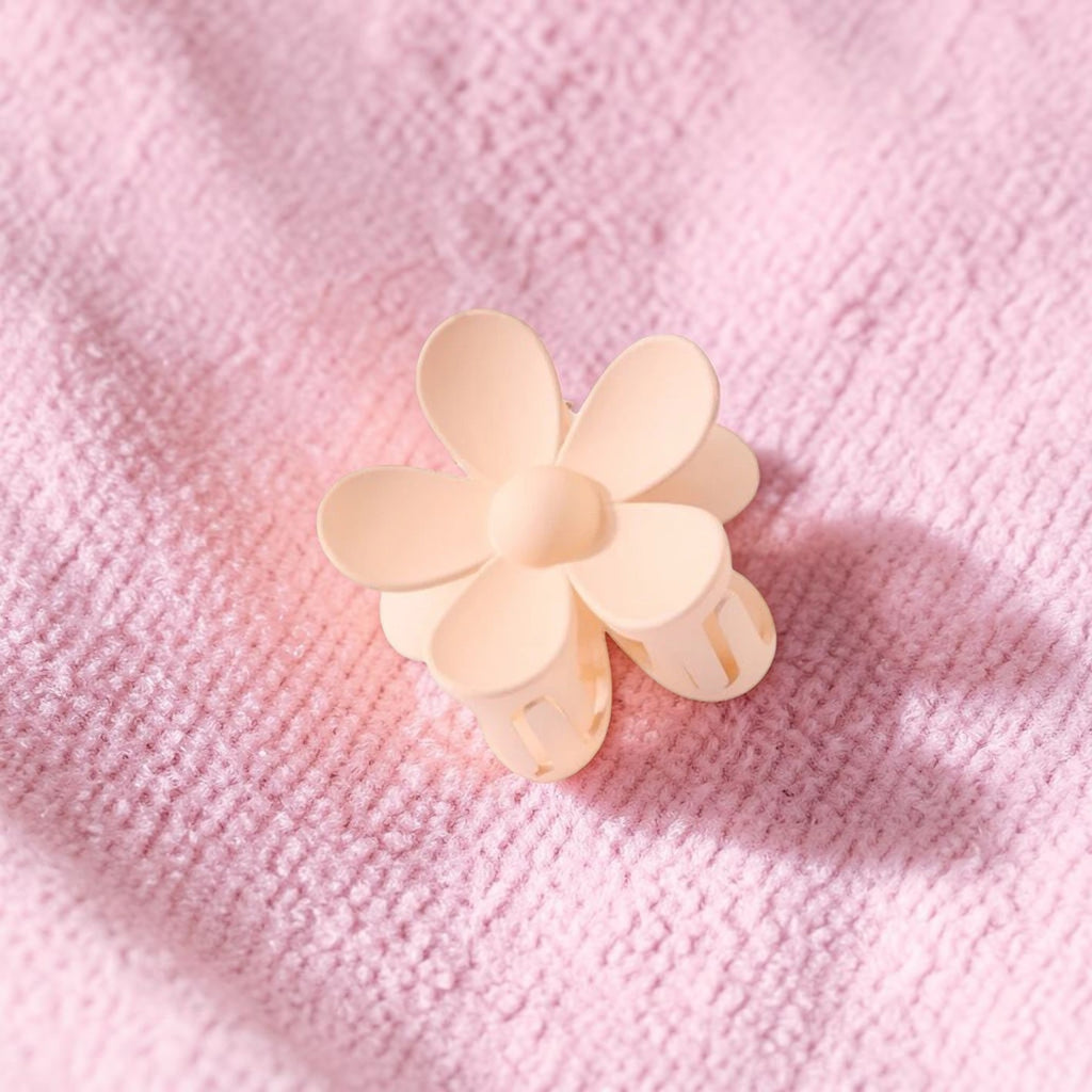 Boxigami pinza de pelo con diseño de flor de 5 pétalos en color melocotón, acabado liso y agarre seguro.