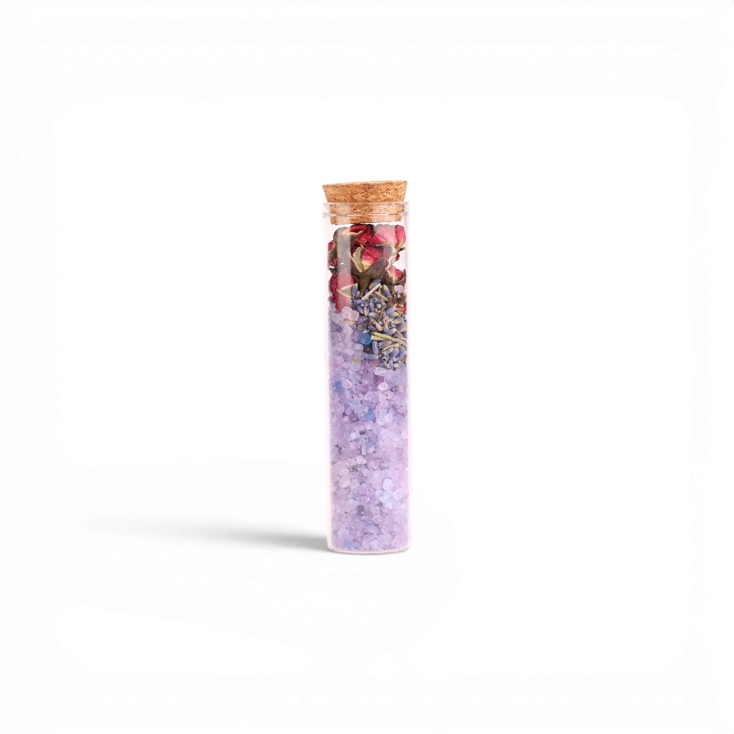Sales de baño Boxigami con sal del Himalaya y flores secas de lavanda y rosa en un vial de vidrio con corcho.