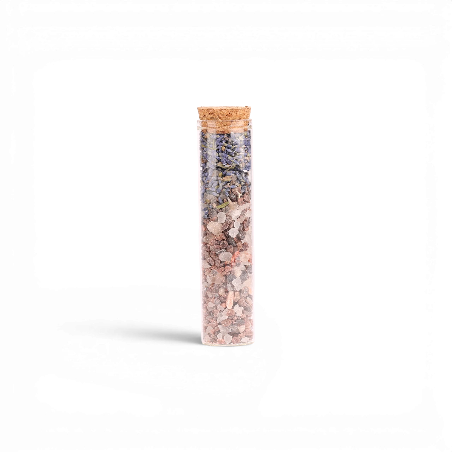 Sales de baño Boxigami con sal del Himalaya y flores secas, en un tubo de ensayo con corcho.